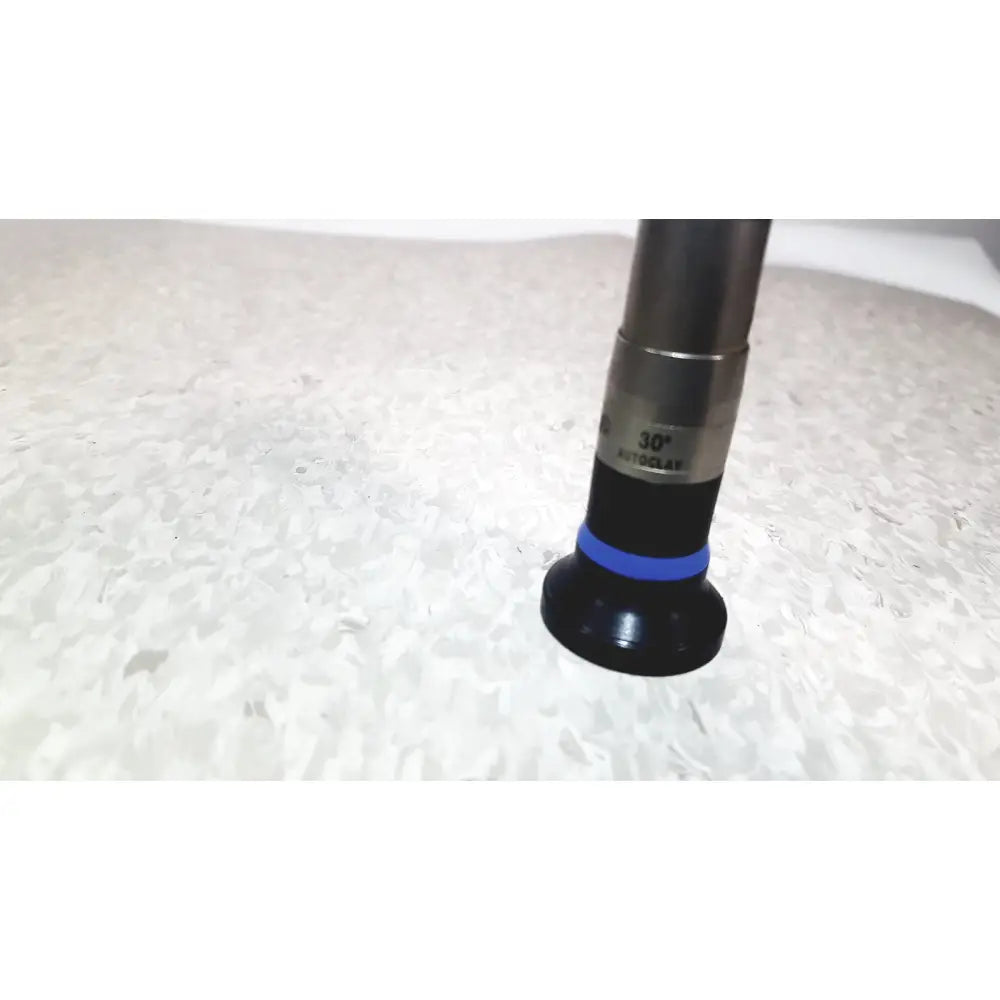 Black and silver olympus wa50373 autoclaveable laparoscope with blue ring near the base used for medical procedures