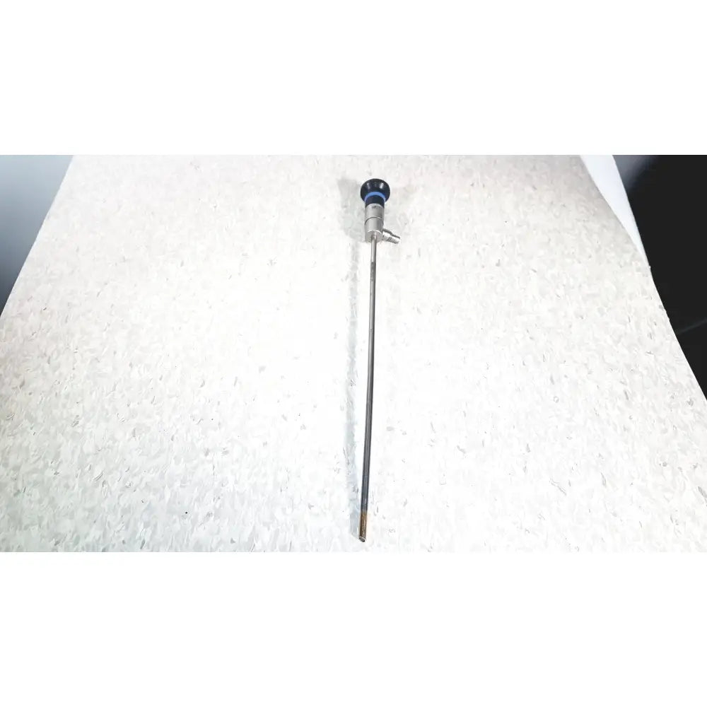 Silver olympus wa50373 autoclaveable laparoscope with blue-tipped handle and metallic shaft for surgical use