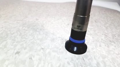 Black and silver olympus wa50373 autoclaveable laparoscope with blue ring near the base used for medical procedures