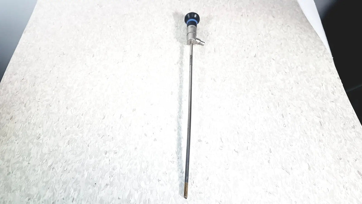 Silver olympus wa50373 autoclaveable laparoscope with blue-tipped handle and metallic shaft for surgical use