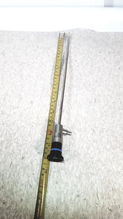 Silver olympus wa50373 autoclaveable laparoscope with black handle and blue ring featuring long slender shaft for medical use