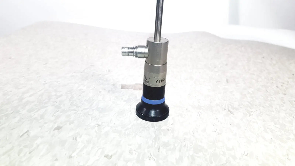 Silver and black olympus wa50373 autoclaveable laparoscope with blue ring near base for laparoscopic medical use