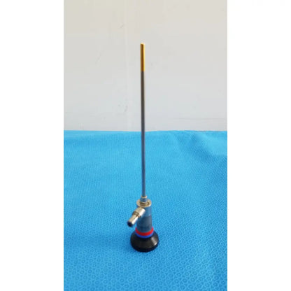 Slender metallic olympus wa96201a autoclavable ent sinuscope with gold-tipped probe and blue red accented cylindrical body