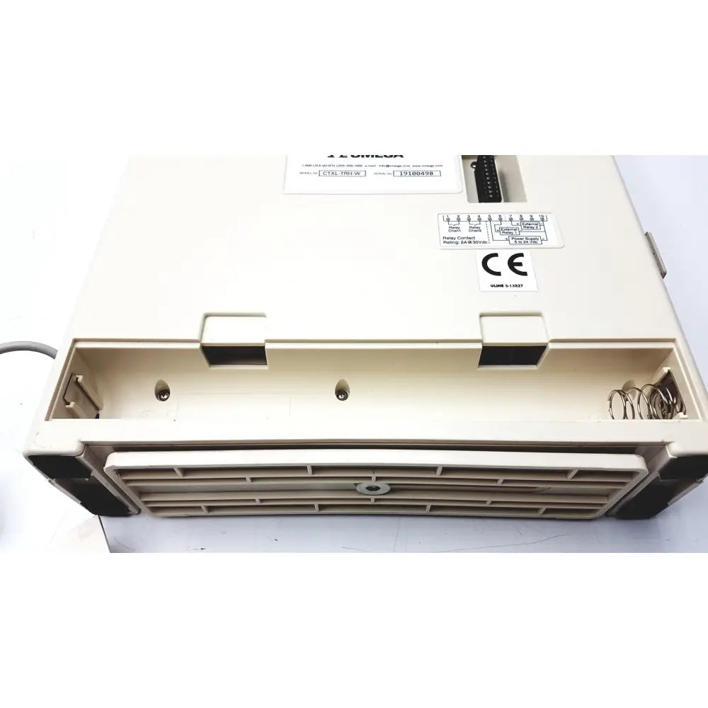 Beige omega ctxl-trh-w humidity chart recorder with black rubberized edges and vented front grille design