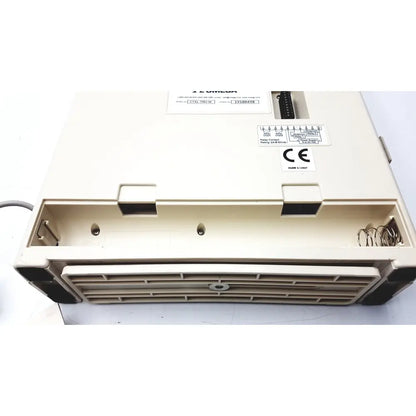 Beige omega ctxl-trh-w humidity chart recorder with black rubberized edges and vented front grille design