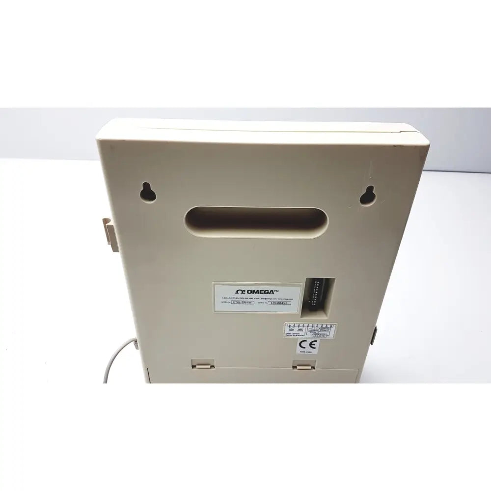Beige omega brand humidity chart recorder with rectangular housing and mounting holes for temperature and humidity recording
