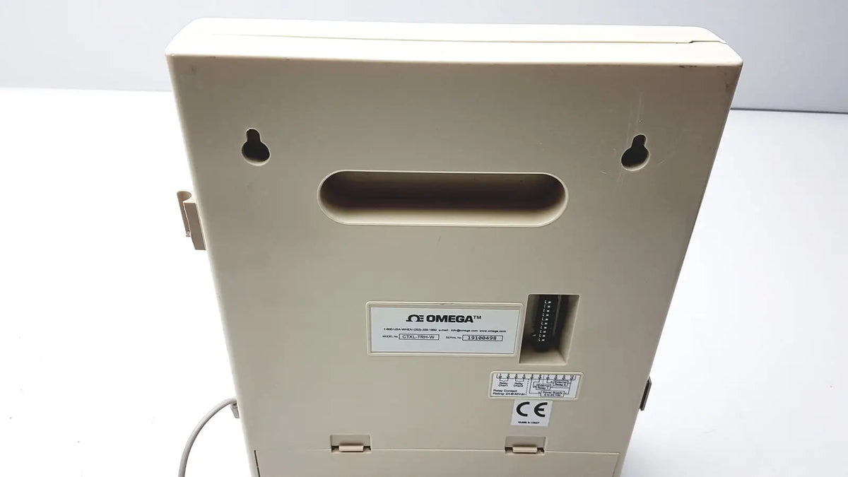 Beige omega brand humidity chart recorder with rectangular housing and mounting holes for temperature and humidity recording