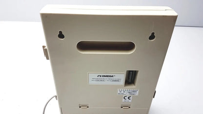 Beige omega brand humidity chart recorder with rectangular housing and mounting holes for temperature and humidity recording
