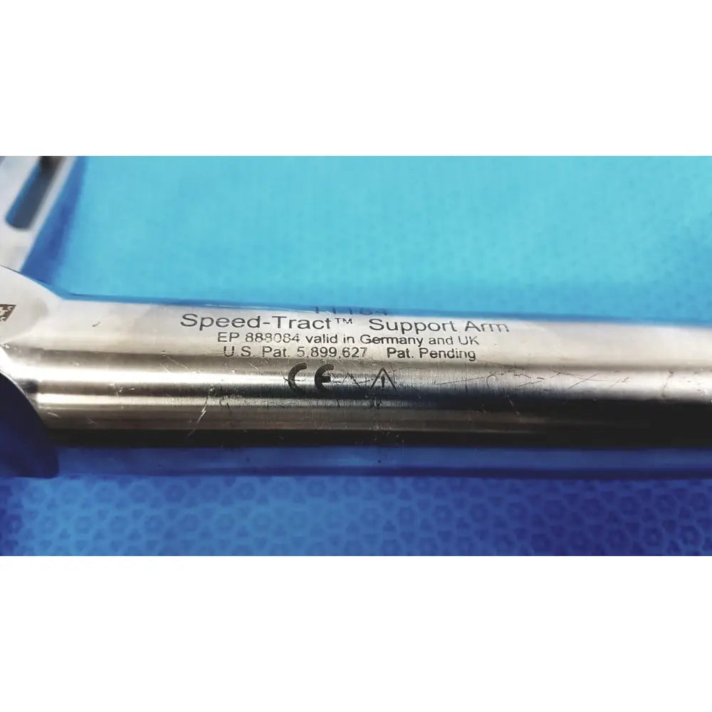 Silver metallic speed-tract support arm with engraved patent markings for stable surgical retraction support
