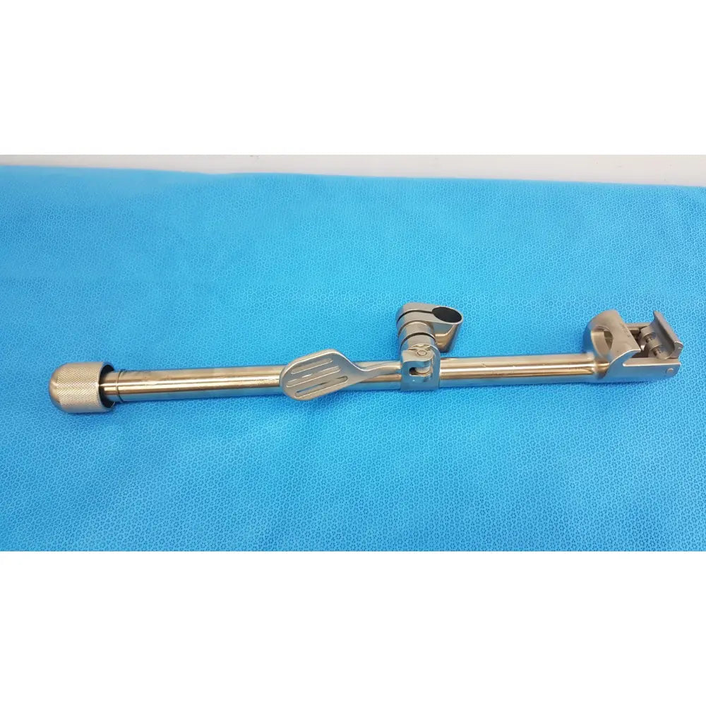 Stainless steel speed-tract field post surgical instrument with textured knob adjustable clamp and articulated joint design