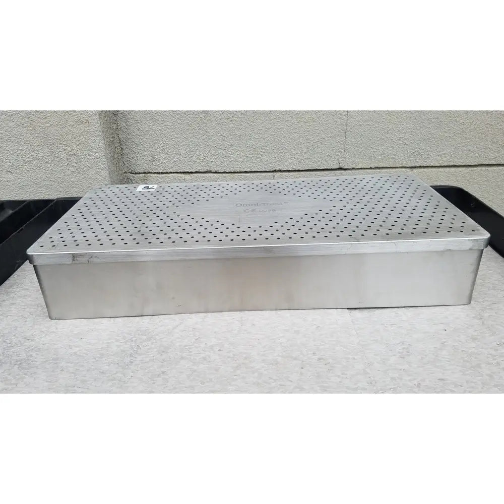 Rectangular stainless steel food steamer with perforated lid and embossed omni tract 3422r brand name for sterilization