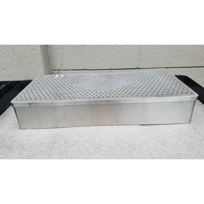 Rectangular stainless steel food steamer with perforated lid and embossed omni tract 3422r brand name for sterilization