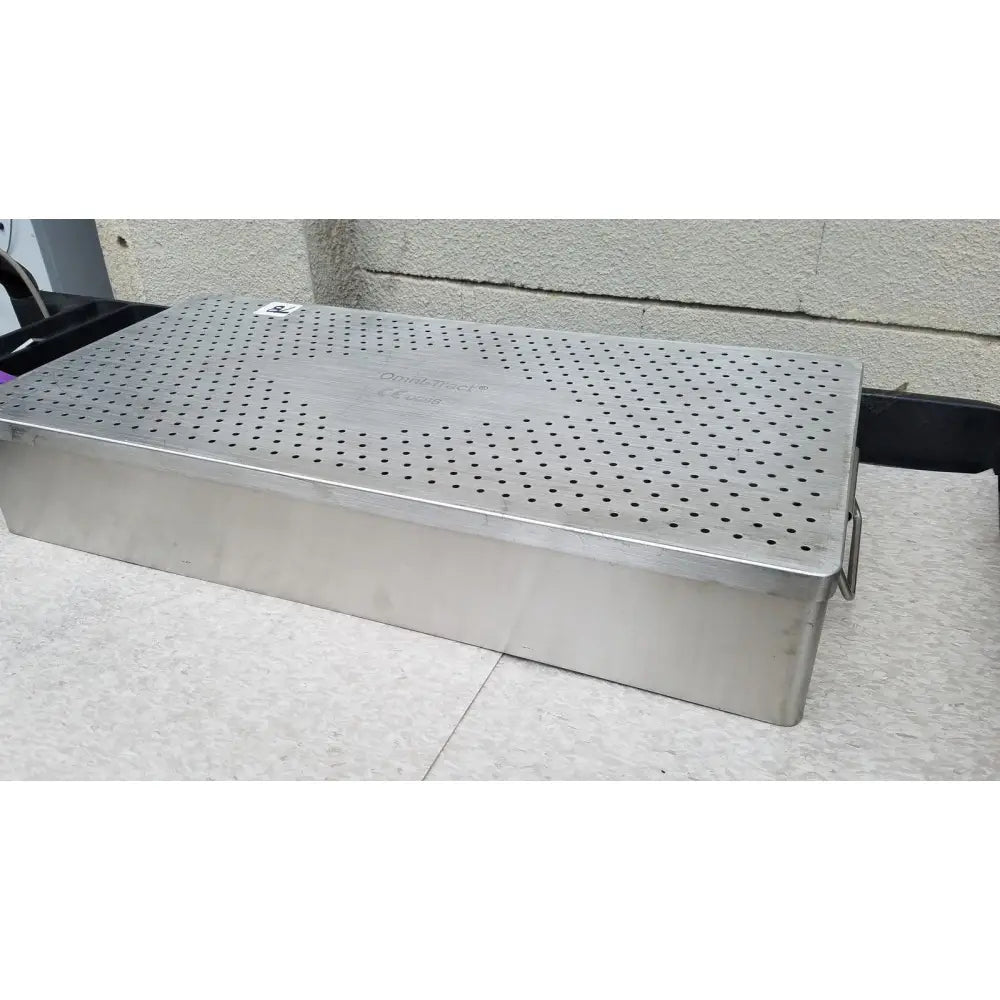 Stainless steel perforated surgical instrument box with side handle in the omni tract 3422r sterilization tray