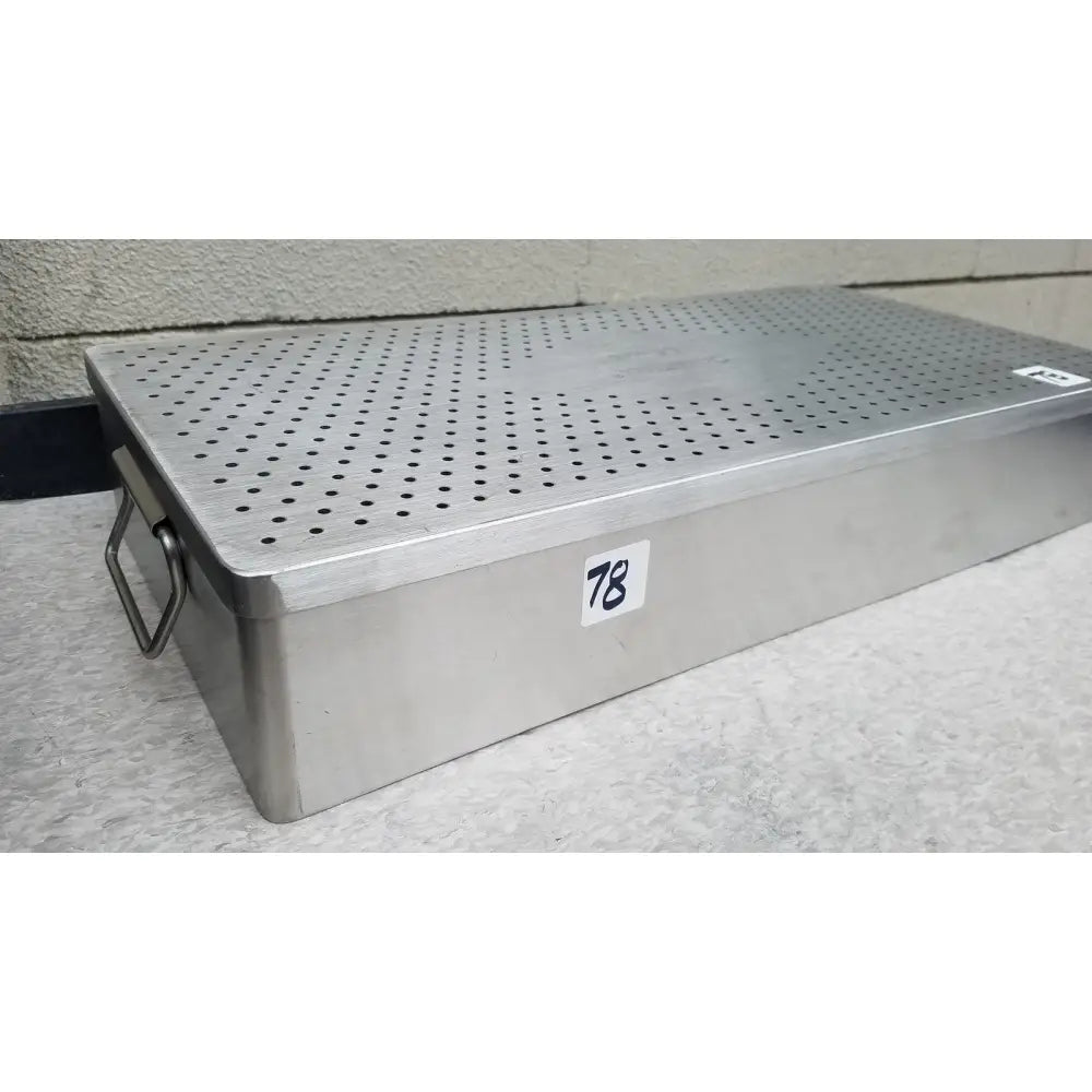 Silver stainless steel rectangular Omni Tract 3422r sterilization tray with perforated lid and side handle