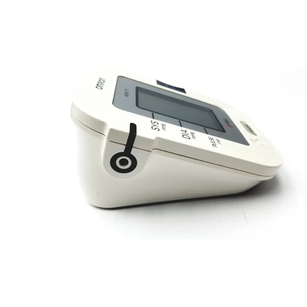 White omron advanced blood pressure monitor model HEM-711AC with sleek compact design and black sys dia pulse labeling