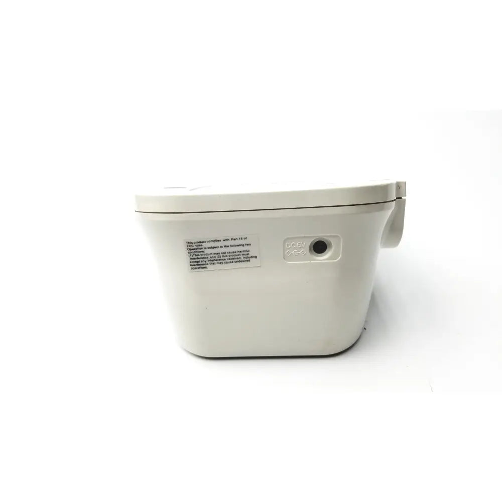 White plastic toilet bowl with rounded edges and hinged lid shown alongside omron advanced blood pressure monitor model hem-711ac box