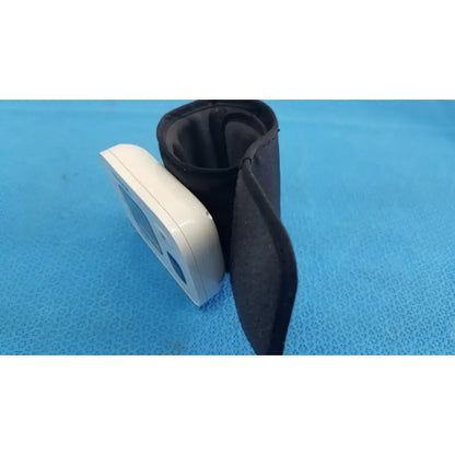 White omron automatic wrist blood pressure monitor with black fabric cuff for accurate automatic wrist blood measurement