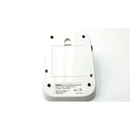 White plastic omron bo760n blood pressure monitor showing rectangular label with model specifications on back side