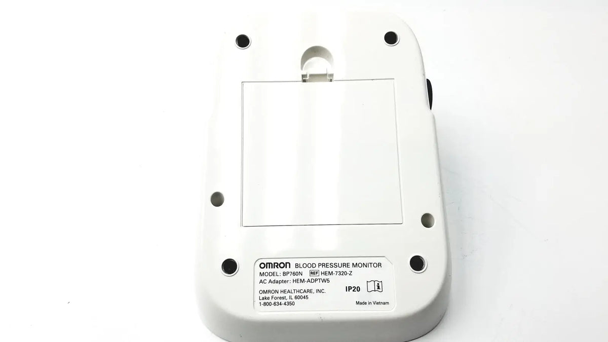 White plastic omron bo760n blood pressure monitor showing rectangular label with model specifications on back side