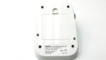 White plastic omron bo760n blood pressure monitor showing rectangular label with model specifications on back side