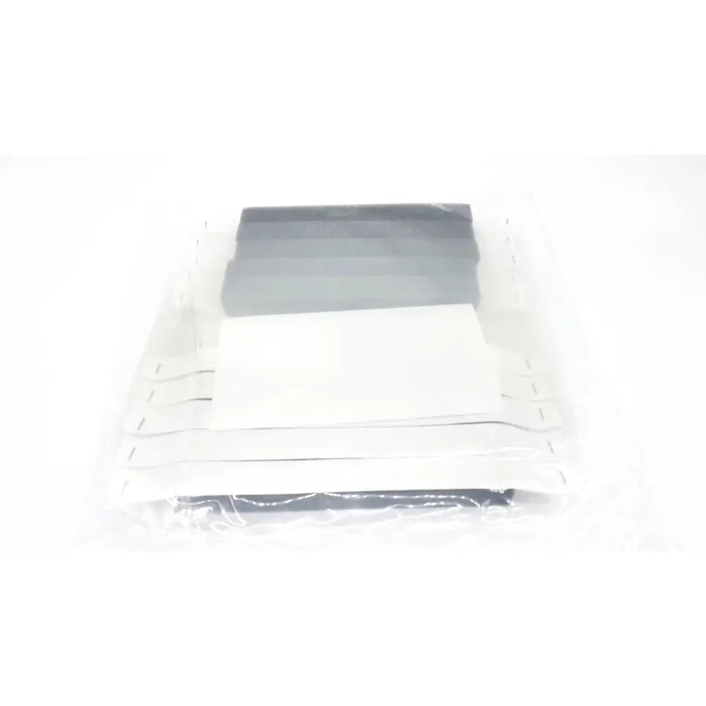 Set of five gray and white rectangular adhesive strips for open source face shield v4 braw foam packaging