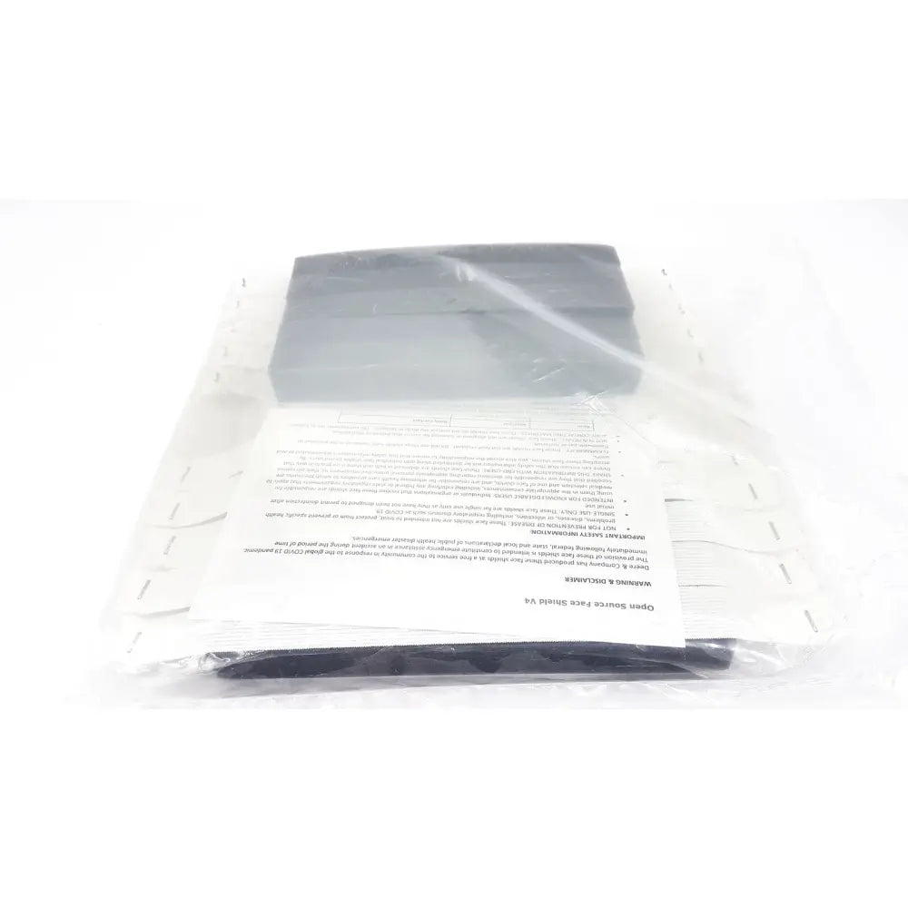 Gray rectangular open source face shield v4 braw foam in clear plastic packaging with instructions and warranty information