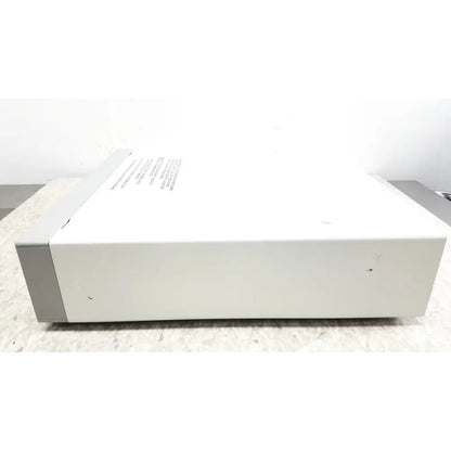 White rectangular electronic device with gray panels and label featuring optronics microcast 3ccd 1080p hd technology