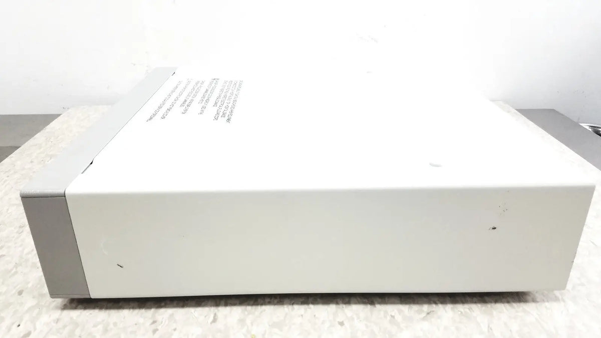 White rectangular electronic device with gray panels and label featuring optronics microcast 3ccd 1080p hd technology