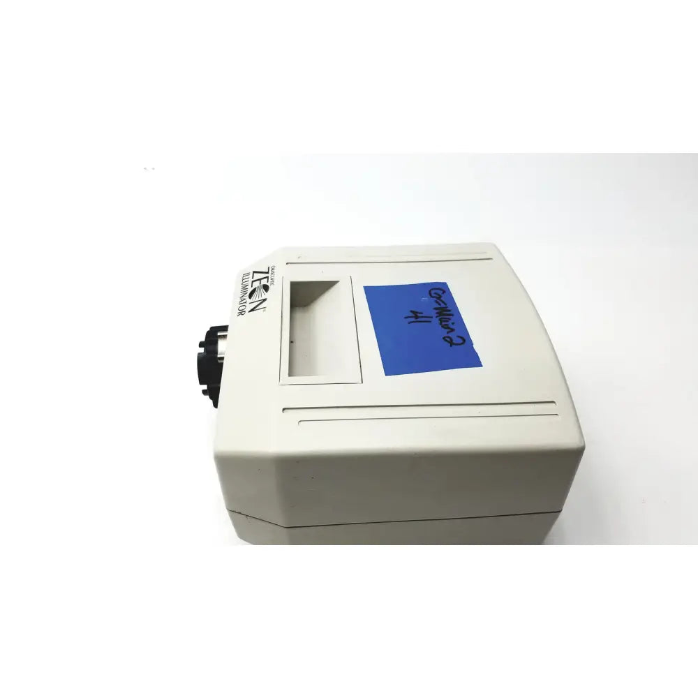 Beige plastic orascoptic zeon illuminator dental fiber optic light source with blue sticky note labeled c-41 on front panel