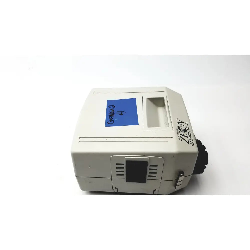 Beige orascoptic zeon illuminator dental fiber-optic light source with blue sticky note labeled gr-micro 2 number 4 on top