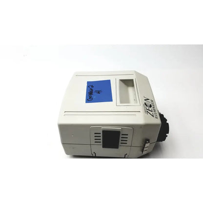 Beige orascoptic zeon illuminator dental fiber-optic light source with blue sticky note labeled gr-micro 2 number 4 on top