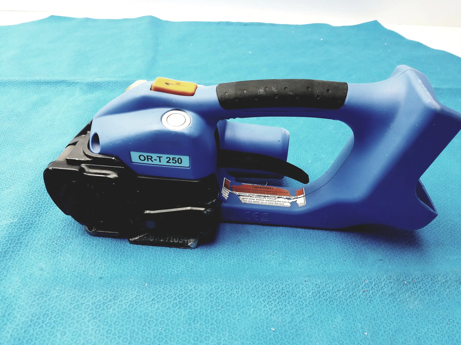 Orgapack OR-T 250 blue and black battery operated cordless electric banding tool with textured grip handle for medical equipment reuse