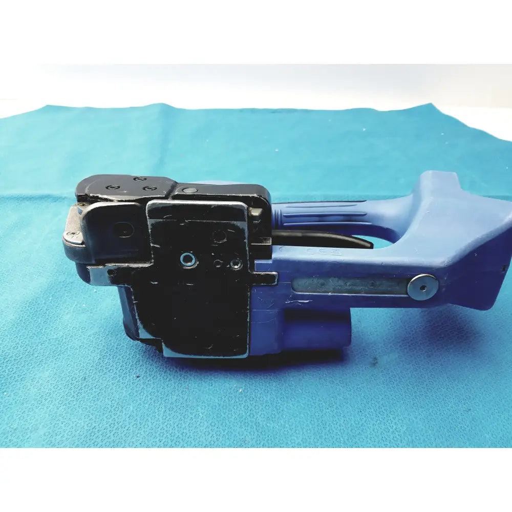Blue plastic and black metal handheld battery operated cordless label applicator with trigger mechanism for reuse medical equipment