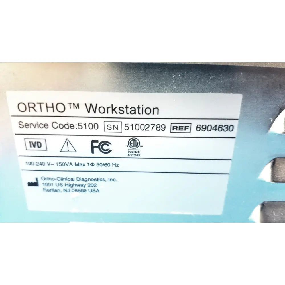 Ortho workstation ref 6904630 by Ortho Clinical Diagnostics with white label on light blue metallic casing back side