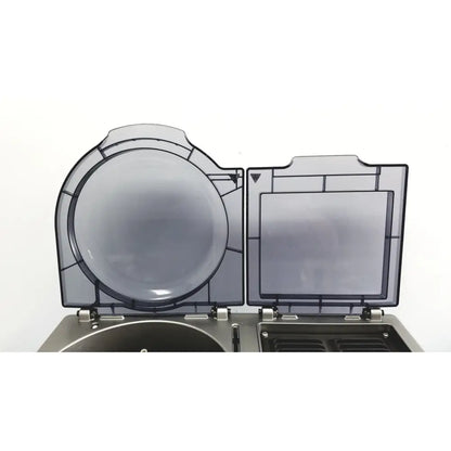 Transparent gray plastic hinged lid with circular and rectangular sections on ortho workstation ref 6904630 by ortho clinical diagnostics