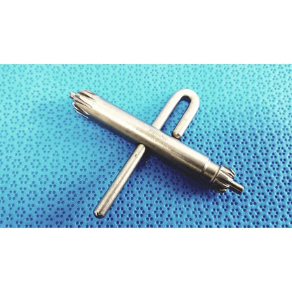 Silver metallic orthopedic drill chuck key with cross-shaped handle and gear-like ends compatible with 3.8mm and 3.2mm pins