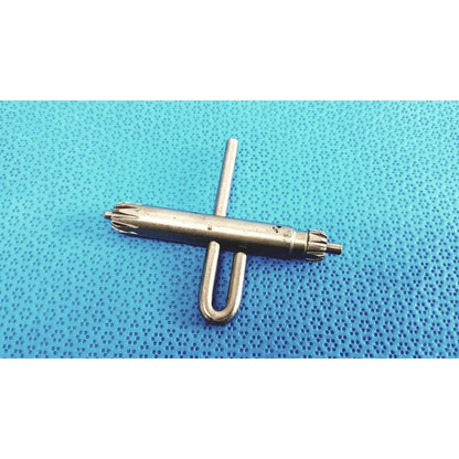 Silver metal orthopedic drill chuck key with u-shaped handle and gear-like ends compatible with 3.8mm and 3.2mm pin holes