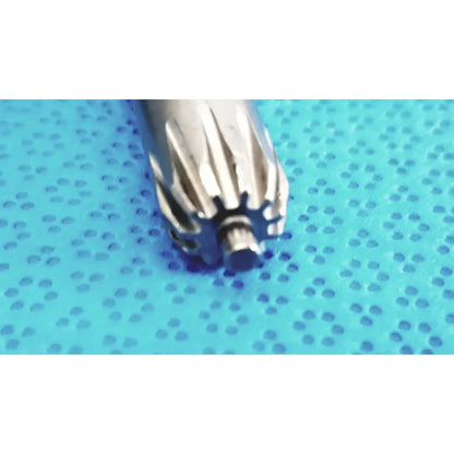 Silver metallic orthopedic drill chuck key with machined teeth and central shaft compatible with 3.8mm and 3.2mm pin holes