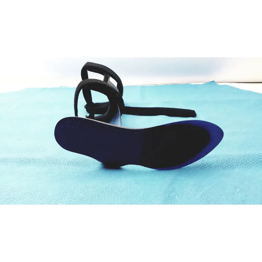 Black strappy orthotic foot drop brace left sandal with glossy blue insole and black sole for foot drop support