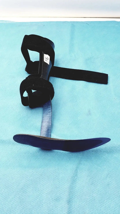 Black orthotic foot drop brace left foot with adjustable straps and curved metal plate for support and stability