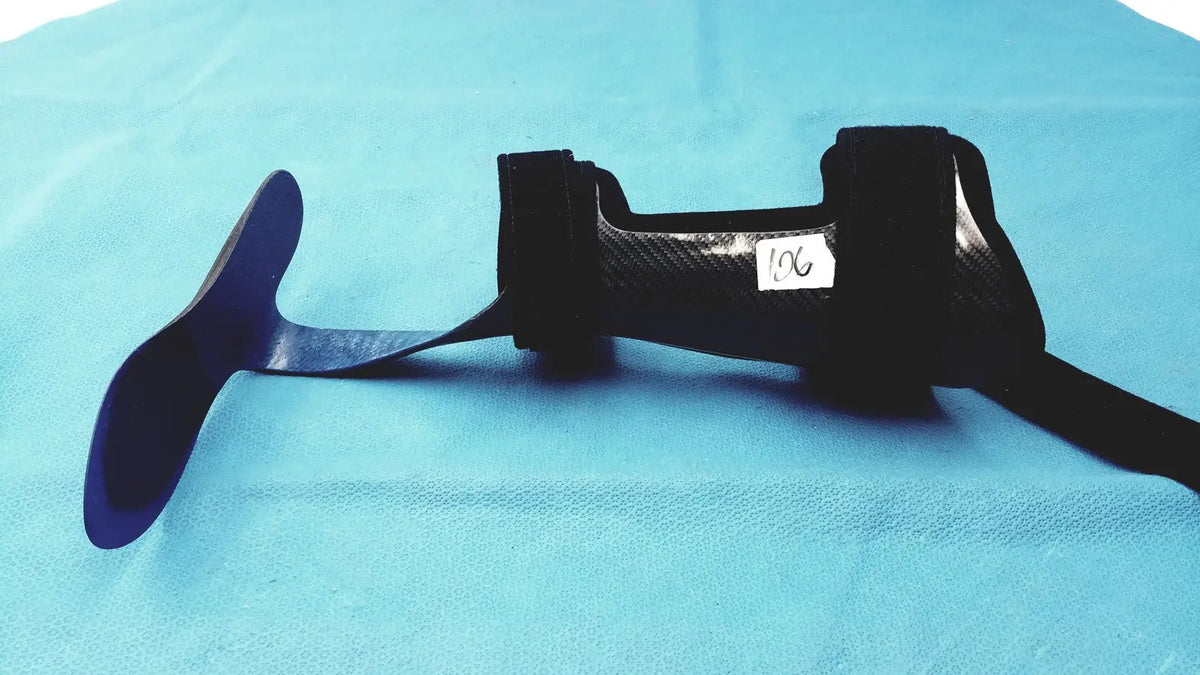 Black carbon fiber orthotic foot drop brace left foot with adjustable straps for support and stability
