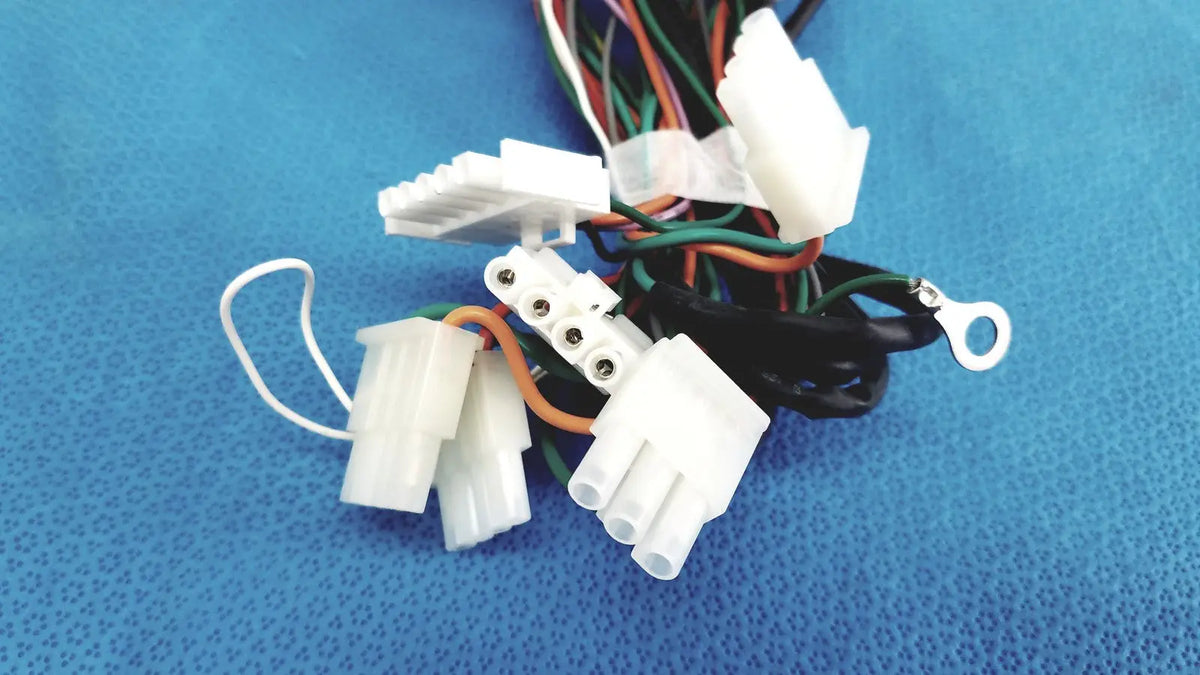 White plastic p10 103 multi-pin connectors wire harness cable with multiple colored wires bundled together