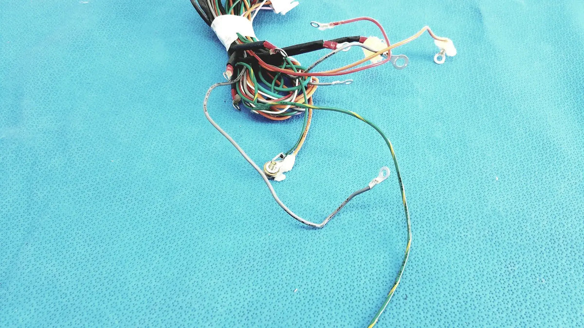 A bundle of multi-colored connectors wire harness with exposed metal connectors and insulated ends tied at the top in p10 103 wire harness cable