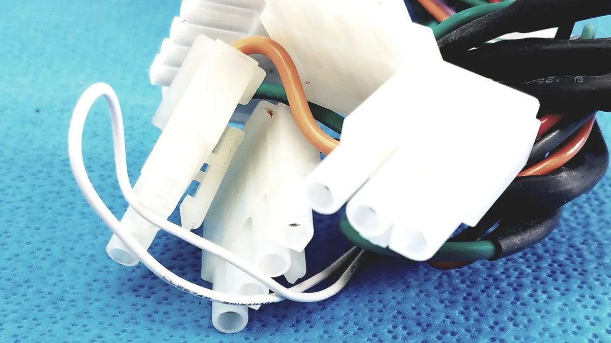 White plastic p10 103 multi-pin connectors wire harness cable with multiple colored wires bundled together