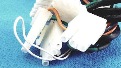 White plastic p10 103 multi-pin connectors wire harness cable with multiple colored wires bundled together