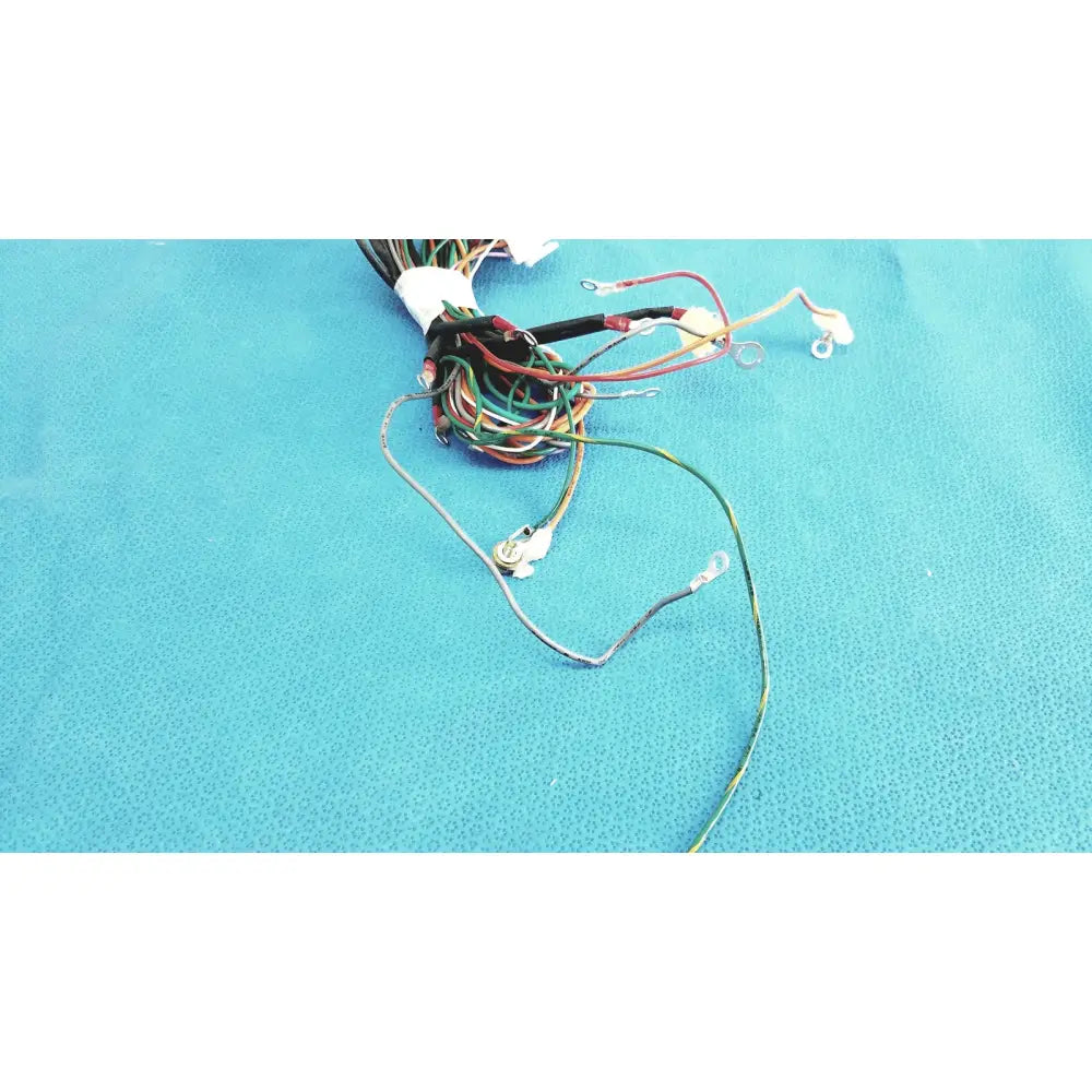 A bundle of multi-colored connectors wire harness with exposed metal connectors and insulated ends tied at the top in p10 103 wire harness cable