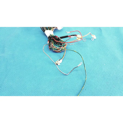A bundle of multi-colored connectors wire harness with exposed metal connectors and insulated ends tied at the top in p10 103 wire harness cable