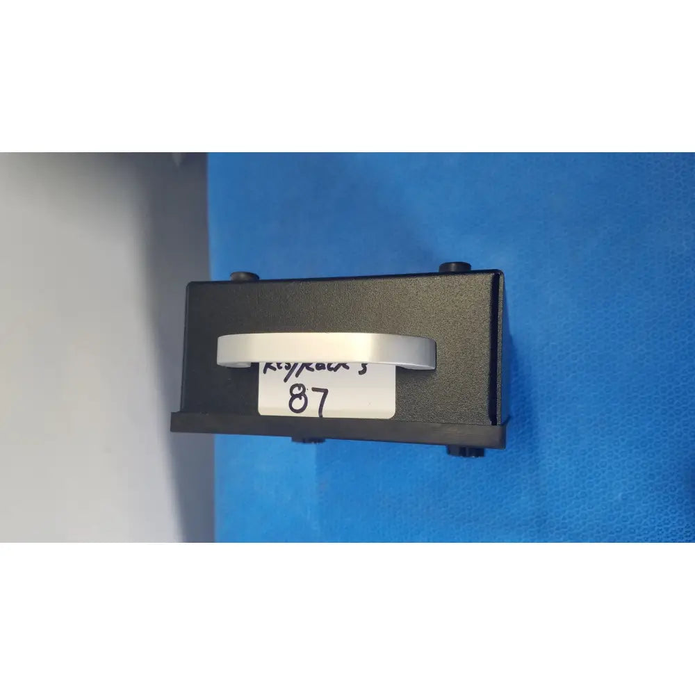 Black rectangular keycard reader with silver metallic handle and white label 87 on parks medical electronics flow detector model 811-b