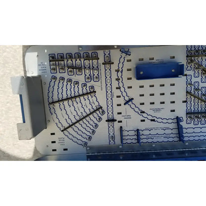Blue and white electronic circuit board of pelvic fragment system implants 7117-4005 designed for reuse medical applications