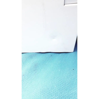 White rectangular box of perkin elmer peri pump cjl8002 resting on a textured turquoise surface for janus g3 workstation
